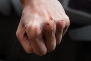 Close-up Of Human Hand Against Gray Background photo