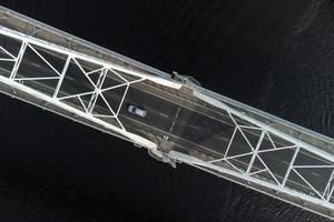 Road bridge over the river, filmed on a copter. photo