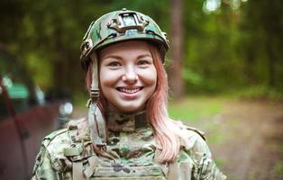 Beautiful portrait of a girl holding a gun photo