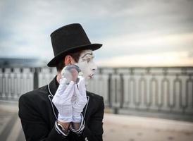 Mime on the street waiting to meet with his lover photo