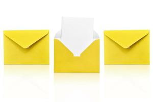 Three yellow envelopes isolated on white background one open with a note inside. Place for your text. Delivery service. photo