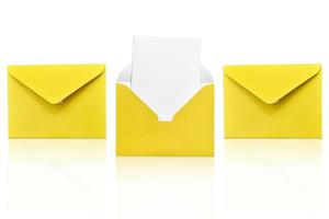 Three yellow envelopes isolated on white background one open with a note inside. Place for your text. Delivery service. photo