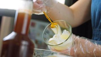 Macro filming of Worcestershire sauce. The chef pours the sauce into a spoon video