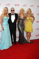 Bridget Marquardt, Hugh Hefner, Holly Madison, and Kendra Wilkinson arrive at the AFI Salute to Warren Beatty at the Kodak Theater in Los Angeles, CA June 12, 2008 photo