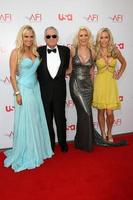 Bridget Marquardt, Hugh Hefner, Holly Madison, and Kendra Wilkinson arrive at the AFI Salute to Warren Beatty at the Kodak Theater in Los Angeles, CA June 12, 2008 photo