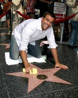 Cameron Mathison cleaning the Susan Lucci Star on the Hollywood Walk of Fame adjacent to the Kodak Theater piror to Daytime Emmys at the Hollywood and Highland complex in Hollywood, CA June 19, 2008 photo