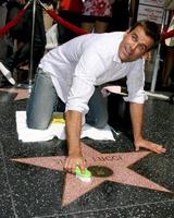 Cameron Mathison cleaning the Susan Lucci Star on the Hollywood Walk of Fame adjacent to the Kodak Theater piror to Daytime Emmys at the Hollywood and Highland complex in Hollywood, CA June 19, 2008 photo