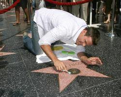 Cameron Mathison cleaning the Susan Lucci Star on the Hollywood Walk of Fame adjacent to the Kodak Theater piror to Daytime Emmys at the Hollywood and Highland complex in Hollywood, CA June 19, 2008 photo