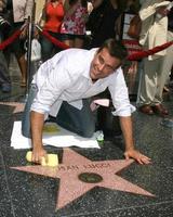 Cameron Mathison cleaning the Susan Lucci Star on the Hollywood Walk of Fame adjacent to the Kodak Theater piror to Daytime Emmys at the Hollywood and Highland complex in Hollywood, CA June 19, 2008 photo