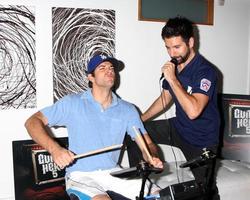 Zachary Levi and Joshua Gomez Chuck Kickoff party presented by Guitar Hero Five Roosevelt Hotel Pool Los Angeles, CA October 10, 2009 photo