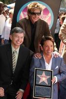 Leron Gubler, Barry Manilow, Chris Gardner and Dave Koz at the Hollywood Walk of Fame Star Ceremony honoring Dave Koz Capital Building in Hollywood Los Angeles, CA September 22, 2009 photo