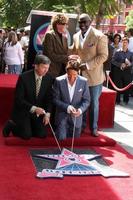 Leron Gubler, Barry Manilow, Chris Gardner and Dave Koz at the Hollywood Walk of Fame Star Ceremony honoring Dave Koz Capital Building in Hollywood Los Angeles, CA September 22, 2009 photo