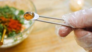 Macro filming of Worcestershire sauce. The chef pours the sauce into a spoon video