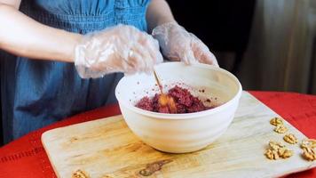 Pkhali traditional Georgian food. Beetroot is used for the purple color. Walnut is used for decoration video