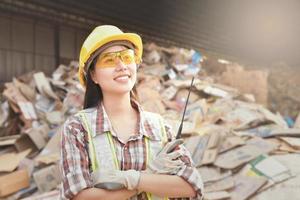 Industrial engineer standing in recycling plant photo