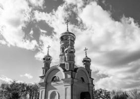 Christian church cross in high steeple tower for prayer photo