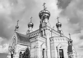 Christian church cross in high steeple tower for prayer photo