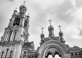 Christian church cross in high steeple tower for prayer photo