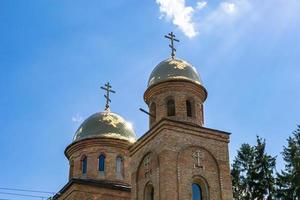 Christian church cross in high steeple tower for prayer photo