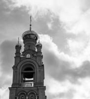 Christian church cross in high steeple tower for prayer photo