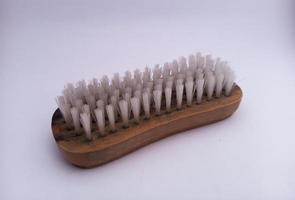 brush the bathroom with a wooden material that looks dirty. With white isolated background photo