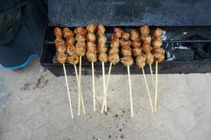 Grilled meatballs  to buy at street food in Indonesia photo