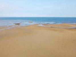 Aerial view of the coast line of teluk lombok beach, East Kalimantan, Indonesia at low tide. photo