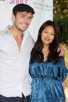 Emrys Cooper and May Wang arriving at the Cure in the Canyons 3 event Four Seasons Hotel Westlake Village Westlake Village, CA October 4, 2009 photo