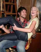 Michael Graziadei and Adrienne Frantz on the set of THe Young and The Restless celebrating Jeanne Cooper s 80th Birthday in Los Angeles, CA on October 24, 2008 photo