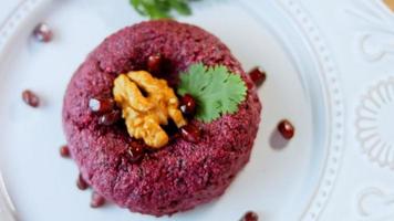 Pkhali traditional Georgian food. Beetroot is used for the purple color. Walnut is used for decoration video