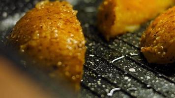 Boil the potatoes in an iron bowl. Macro shooting on intense steam video