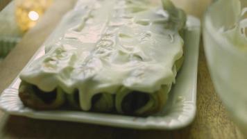 Cake with green dough, sour cherries and sour cream. It also has food ornament and the red star cake video