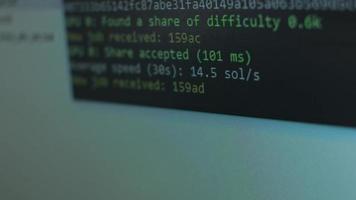 Cryptocurrency mining on a computer screen. The algorithm of the computer program on the monitor. Execution of the program code for the mining program. Pop-up lines of a computer program. video