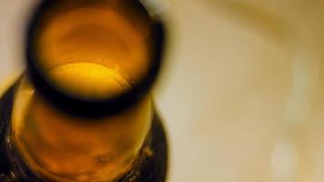 Glass with fresh and sparkling beer. In the background is a romantic atmosphere with lights video