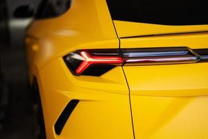 Back lights of yellow sport car suv. photo