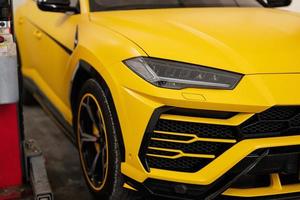 Headlights of yellow sport car suv. photo