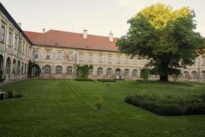 Courtyard with peacocks of Benedictine monastery in Rajhrad photo