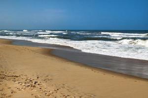 The view on the sea waves near to beach. photo