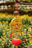 Vietnamese New Year decoration on a blurred background of yellow flowers. Hue, Vietnam. photo