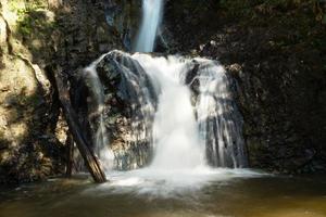 Scenic view on Mae Yen Waterfall with white water on a sunny day. Pai, Thailand. photo