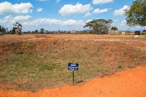 Phonsovan, Xieng Khouang Province, Laos - January 28, 2018. Bomb crater near to unique archaeological site Plain of Jars. photo