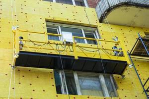 Insulation of the walls of a multi-storey building, The cradle of the lift. photo