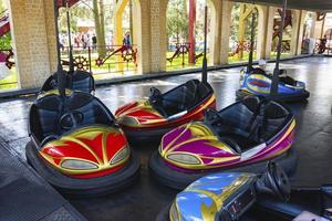 Colorful bumper cars, racing cars in amusement park, racing with bumps
