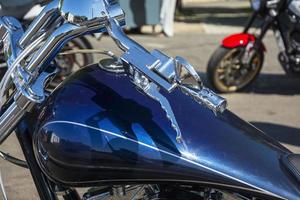 Beautiful top view of a motorcycle, blue motorcycle gas tank, motorcycle steering wheel, Shining chrome, gas handle. photo