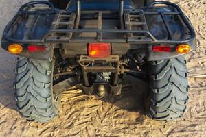 Off-road ATV on the sandy beach of the sea, quad bike rides, active recreation, tourism photo