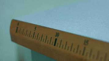 Sewing table with ruler on it. We can measure the size of the material to be sewn or cut video