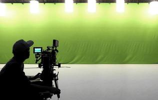 Camera man working in studio. photo