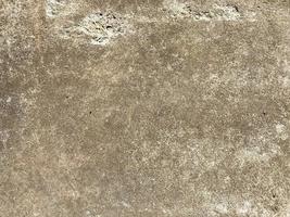 Surface texture of natural building solid gray strong concrete, rough cement with small pebbles. The background photo