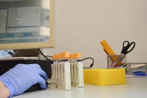 Physician using computer for examination stock photo