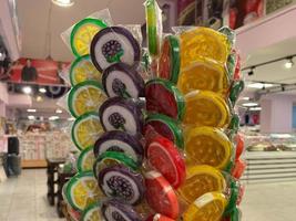 A lot of Christmas lollipops at market stall photo